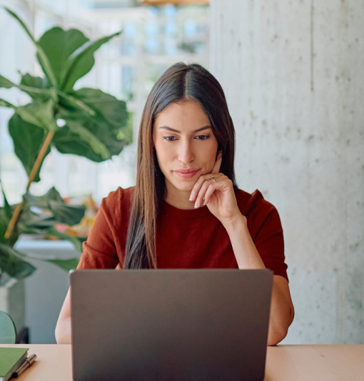 Woman looking stressed at laptop researching home loans